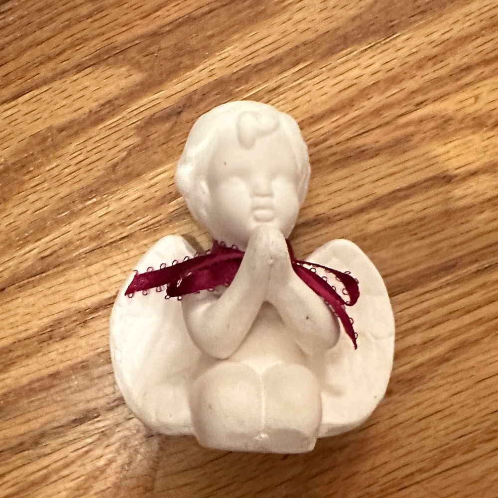 White Angel Figurine with Red Ribbon